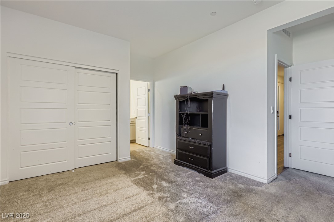 314 Robson Rdg Lane Henderson, NV 89015 - Photo 25 of 64 NEXT GEN Bedroom featuring light carpet and a closet