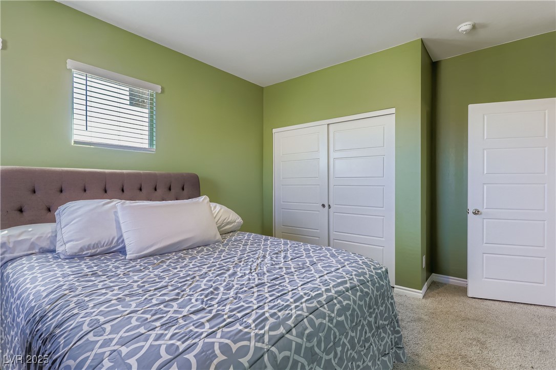 314 Robson Rdg Lane Henderson, NV 89015 - Photo 34 of 64 Bedroom featuring light colored carpet and a closet