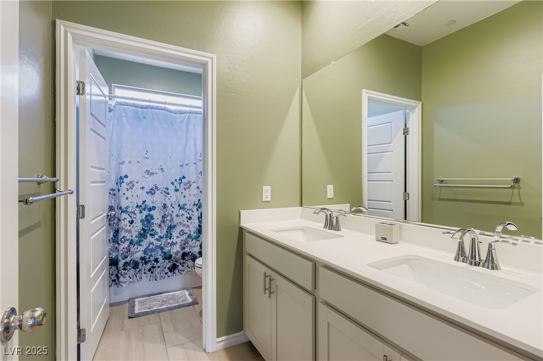 314 Robson Rdg Lane Henderson, NV 89015 - Photo 35 of 64 Bathroom with a sink and shower / bath combo
