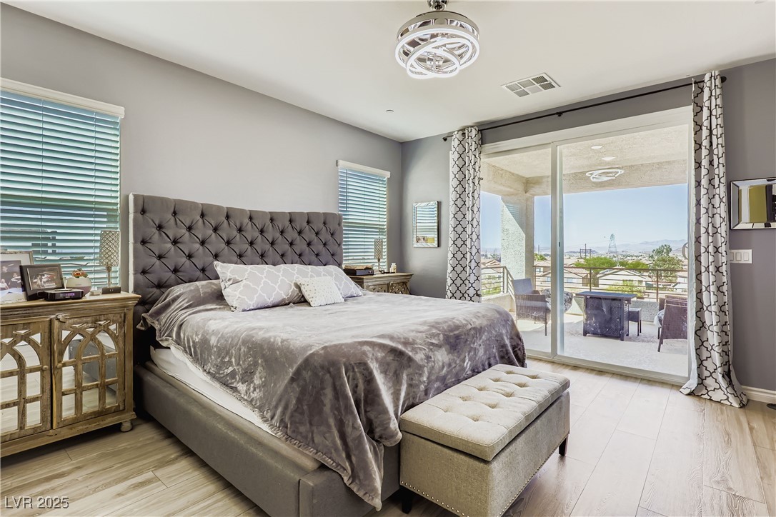 314 Robson Rdg Lane Henderson, NV 89015 - Photo 40 of 64 Bedroom featuring light wood-style floors and access to outside