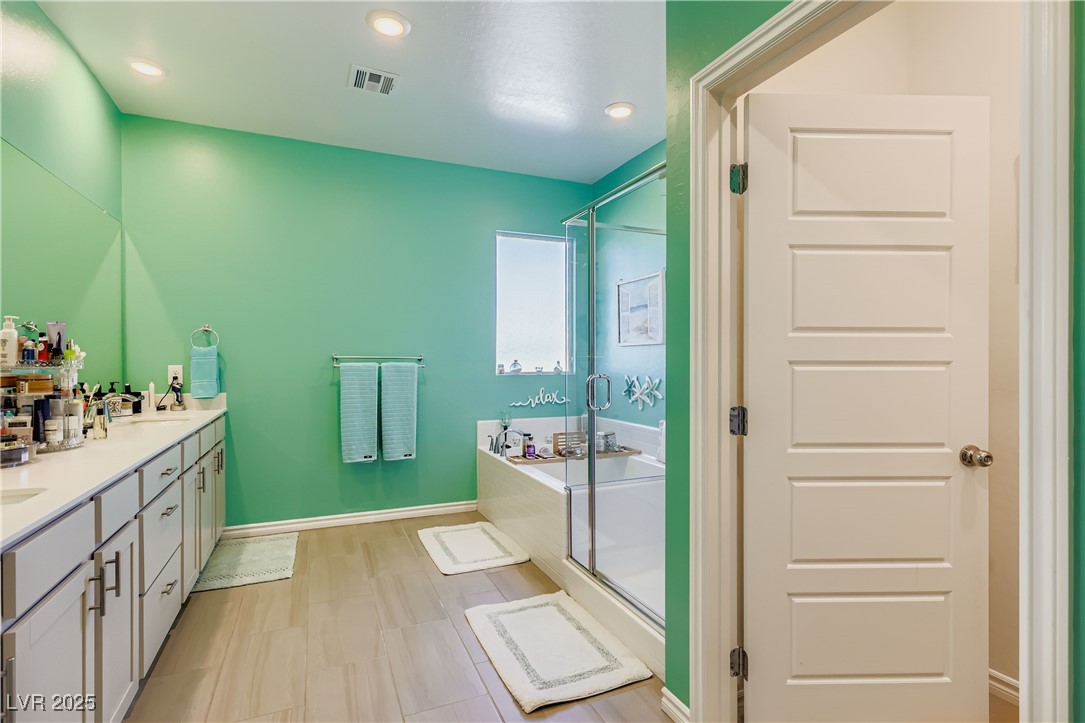 314 Robson Rdg Lane Henderson, NV 89015 - Photo 45 of 64 Bathroom with a shower stall, a bath, and recessed lighting