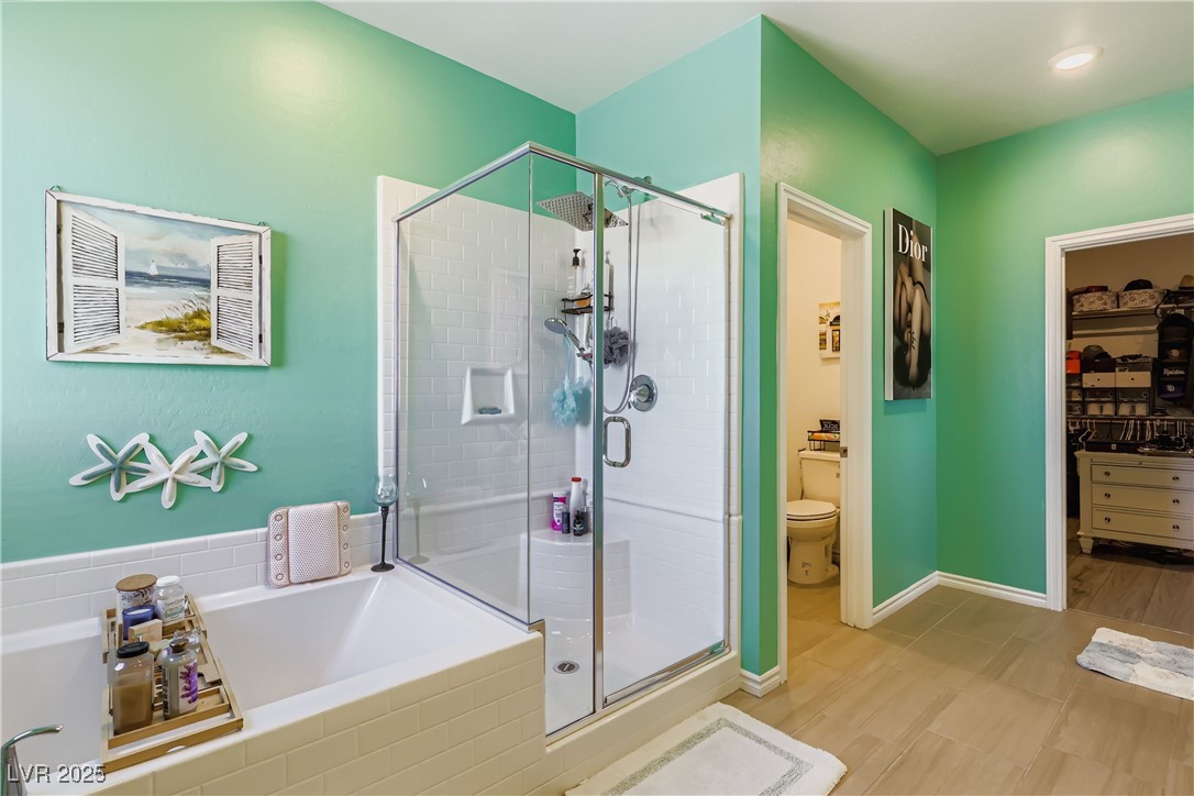 314 Robson Rdg Lane Henderson, NV 89015 - Photo 46 of 64 Full bathroom with a stall shower, a bath, and a walk in closet