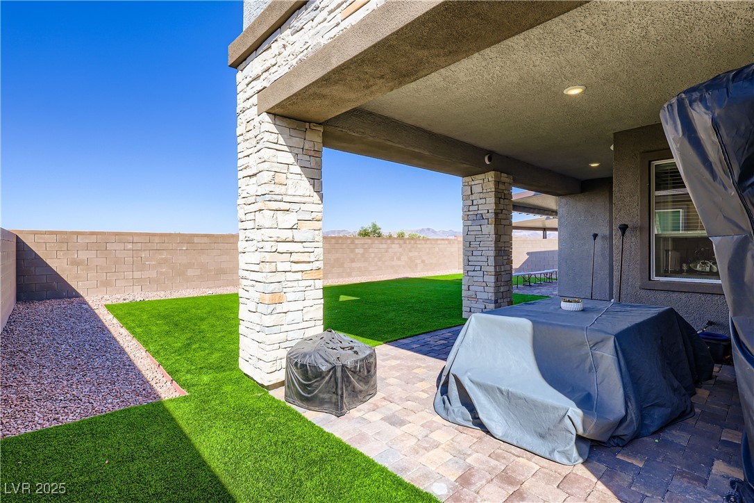 314 Robson Rdg Lane Henderson, NV 89015 - Photo 51 of 64 Fenced backyard featuring a patio area and area for grilling