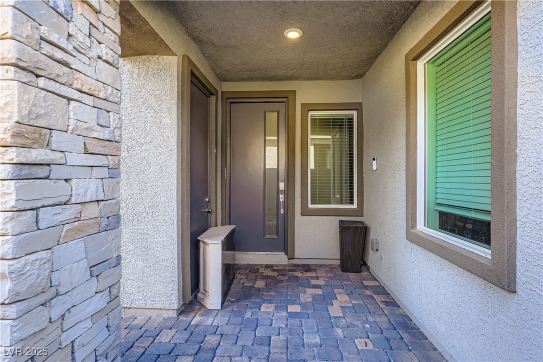 314 Robson Rdg Lane Henderson, NV 89015 - Photo 6 of 64 View of exterior entry with stucco siding