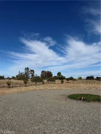 a view of a lake with houses in the back
