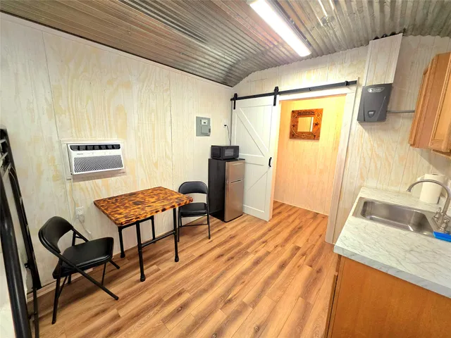 a bedroom with a bed and wooden furniture