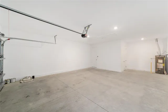a view of an empty room and window with a swimming pool