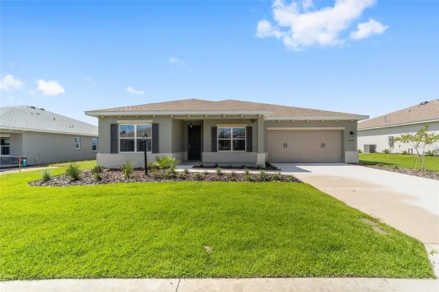a view of a house with backyard porch and garden