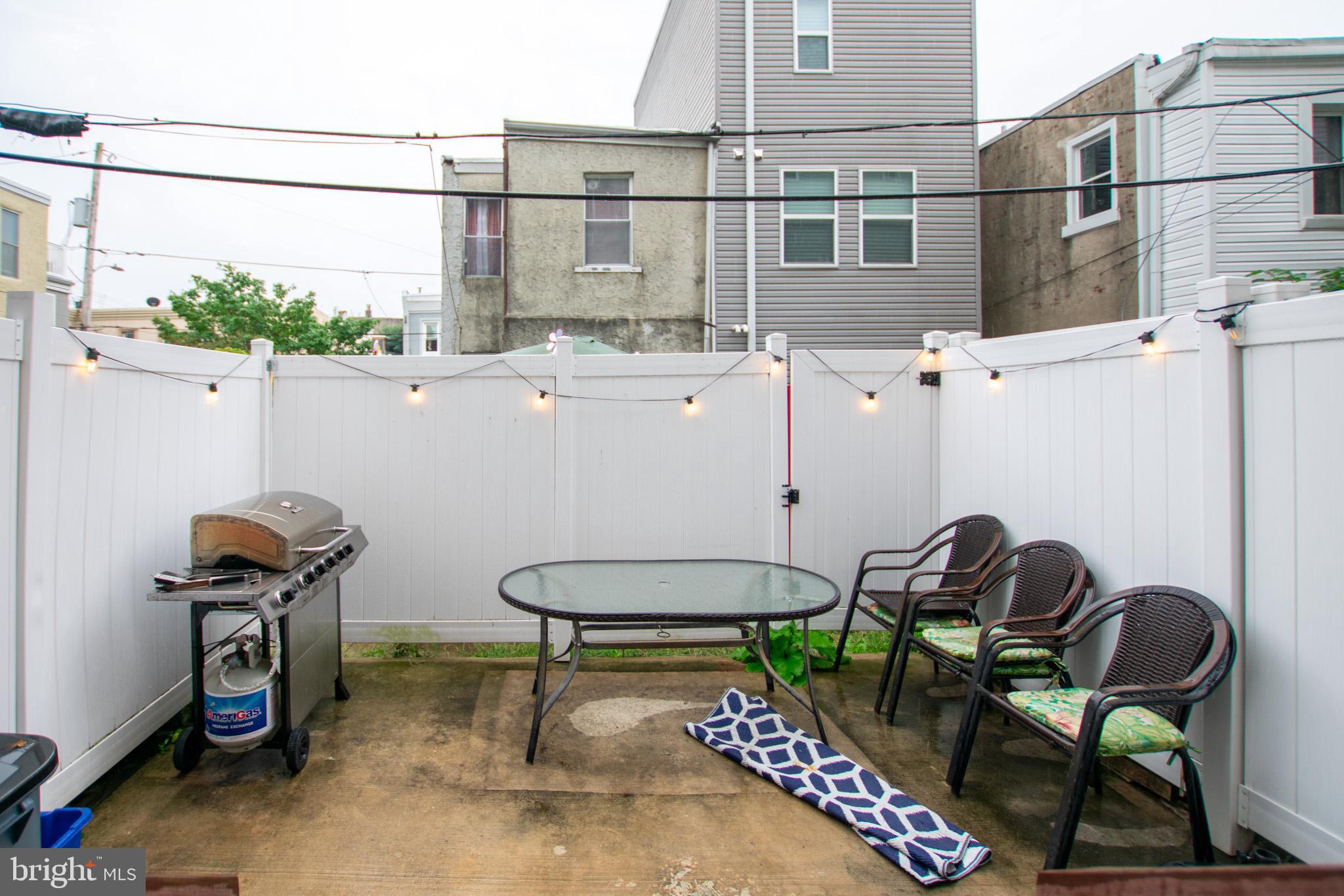 1910 Fernon Street Philadelphia, PA 19145 - Photo 12 of 44 a backyard of a house with table and chairs