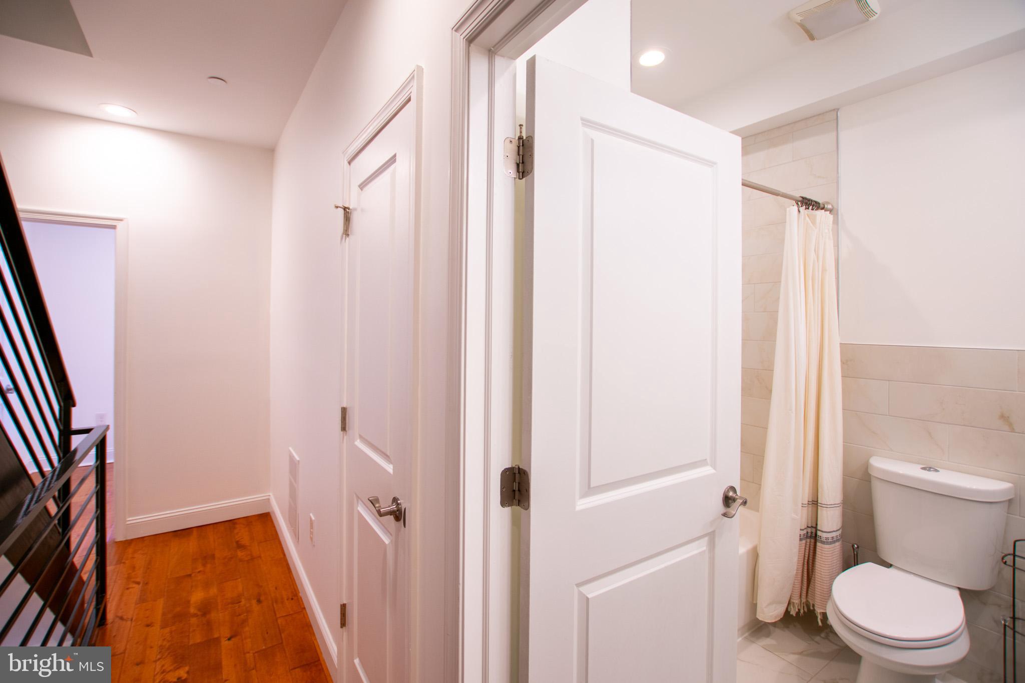 1910 Fernon Street Philadelphia, PA 19145 - Photo 17 of 44 a bathroom with a toilet and a shower