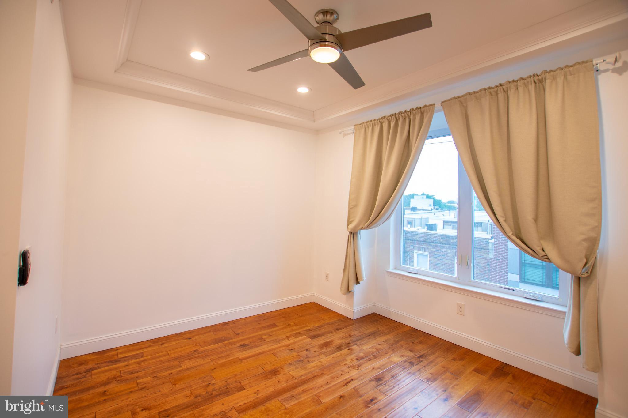 1910 Fernon Street Philadelphia, PA 19145 - Photo 31 of 44 an empty room with windows and entrance