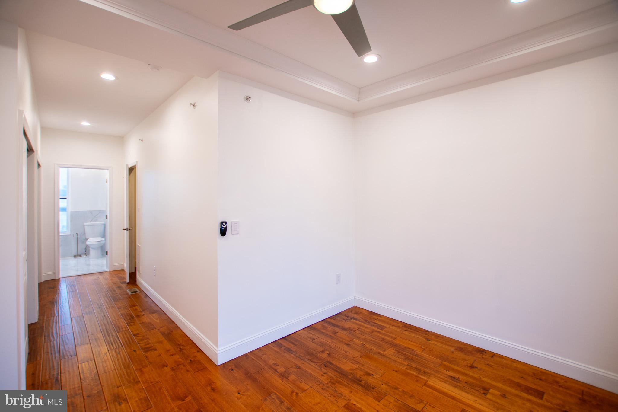 1910 Fernon Street Philadelphia, PA 19145 - Photo 35 of 44 a view of a hallway with wooden floor