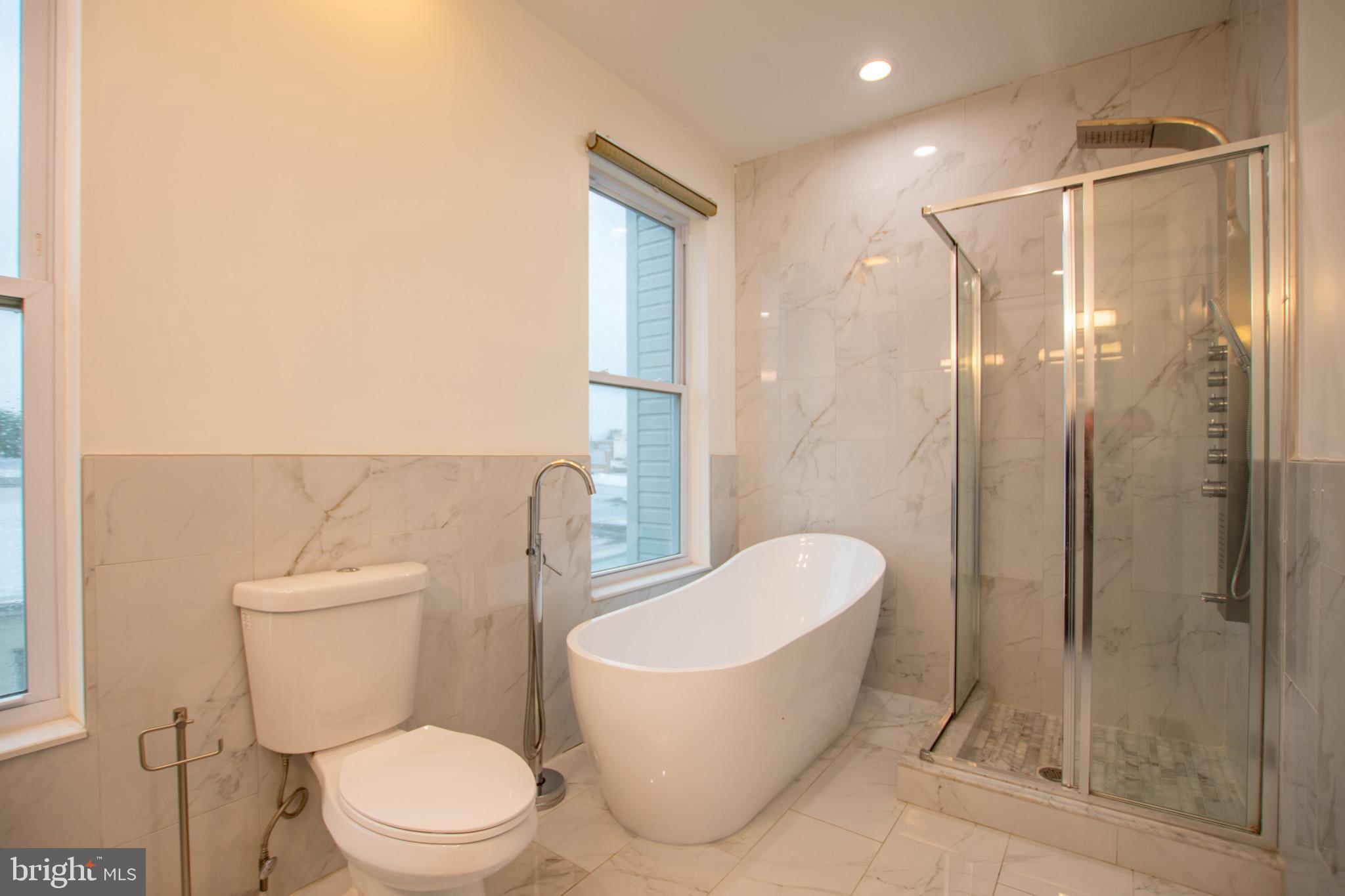 1910 Fernon Street Philadelphia, PA 19145 - Photo 38 of 44 a white toilet sitting next to a bathroom sink