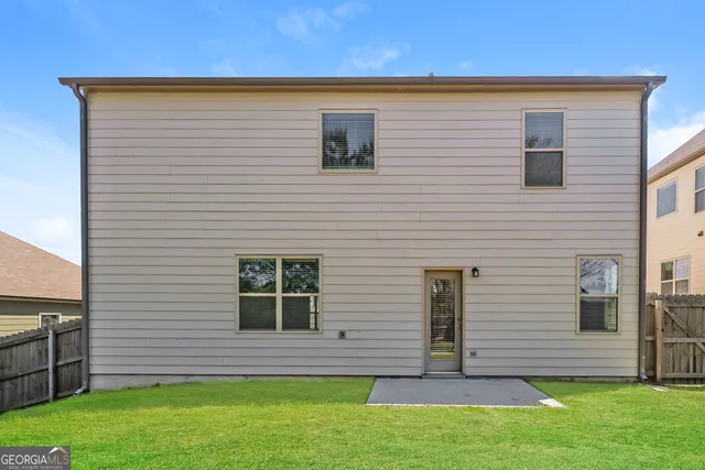 a view of front door of house and yard