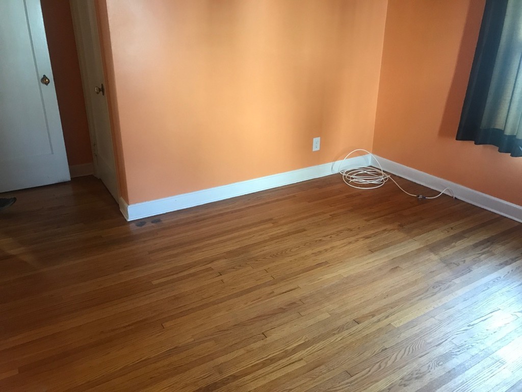 133 Russell Street Springfield, MA 01104 - Photo 8 of 15 a view of an empty room with wooden floor