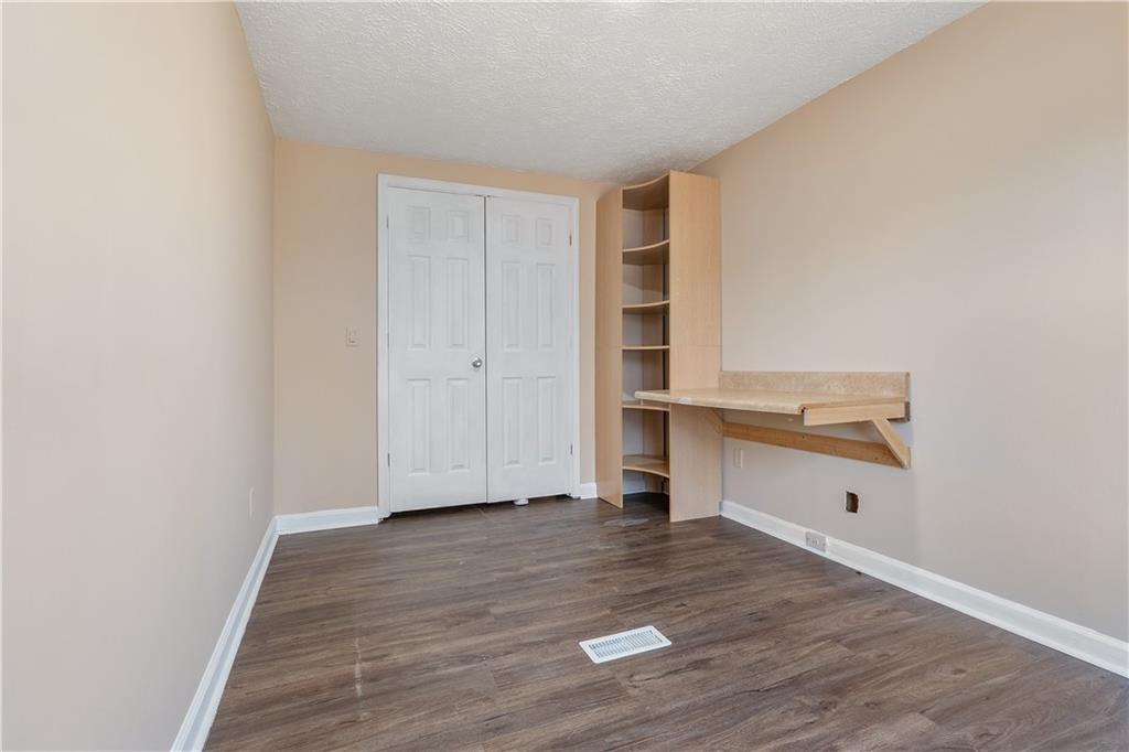 5498 Woodlin Road Lula, GA 30554 - Photo 22 of 40 a view of empty room with wooden floor