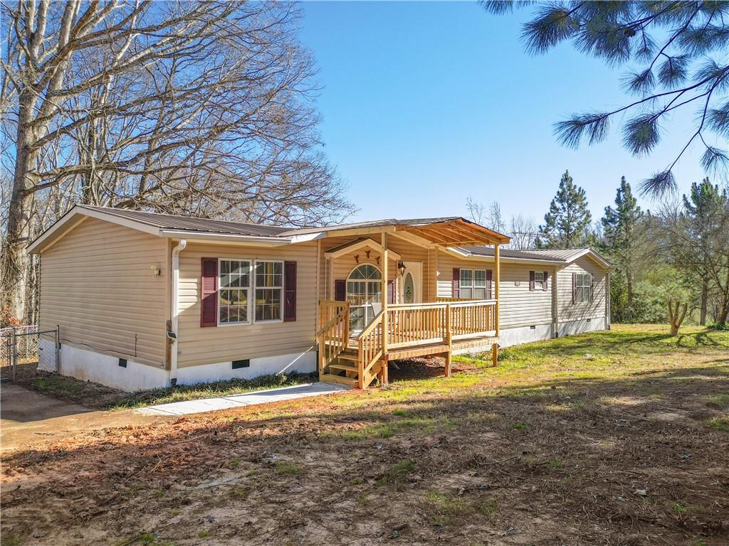 5498 Woodlin Road Lula, GA 30554 - Photo 38 of 40 a view of a house with a yard