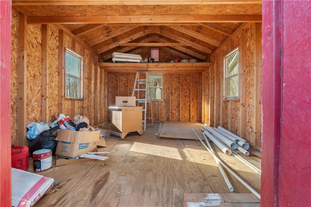 5498 Woodlin Road Lula, GA 30554 - Photo 40 of 40 a view of a deck with wooden floor and a tub