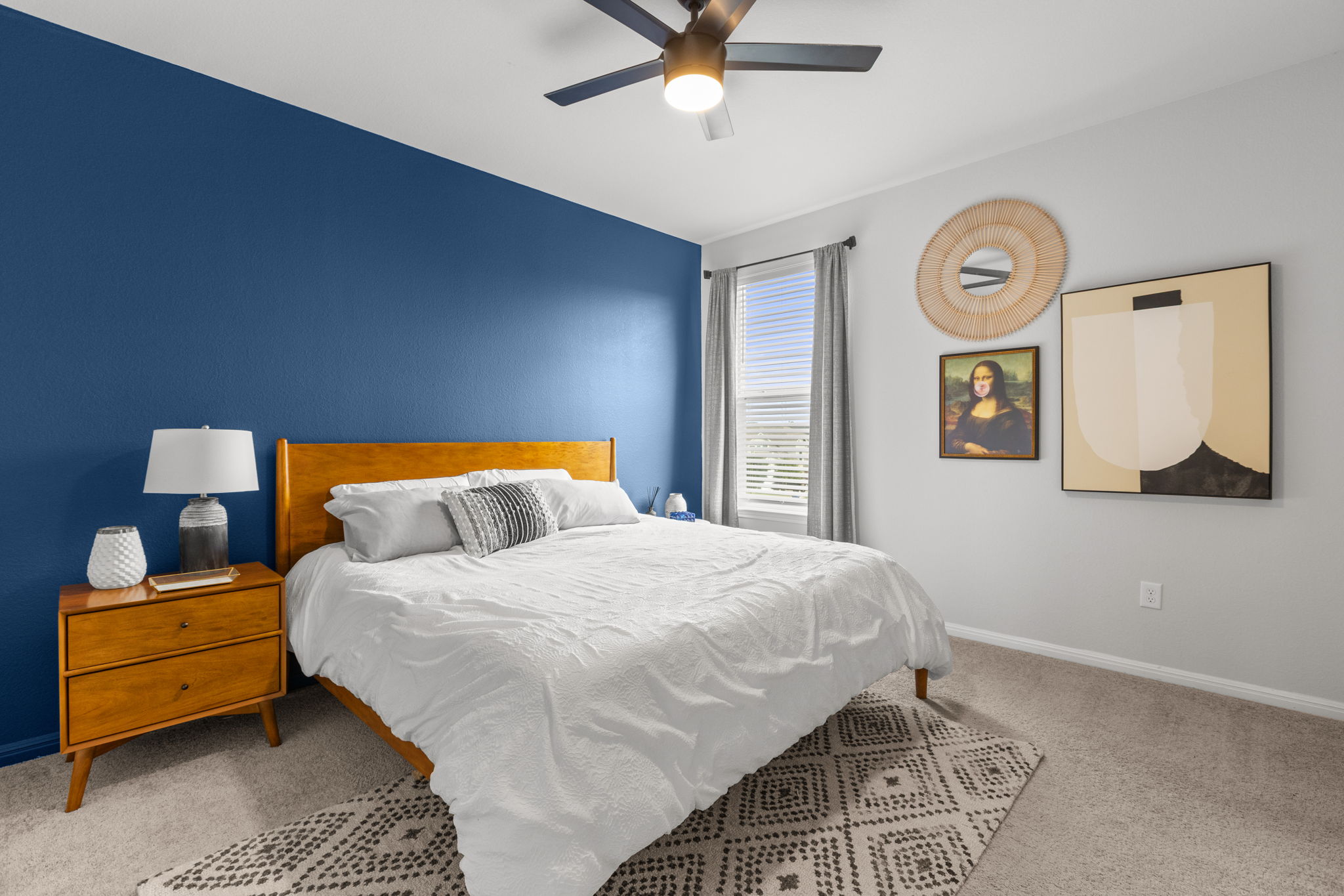 6402 Rafferty Lane Austin, TX 78747 - Photo 21 of 32 a bedroom with a bed and painting on the wall