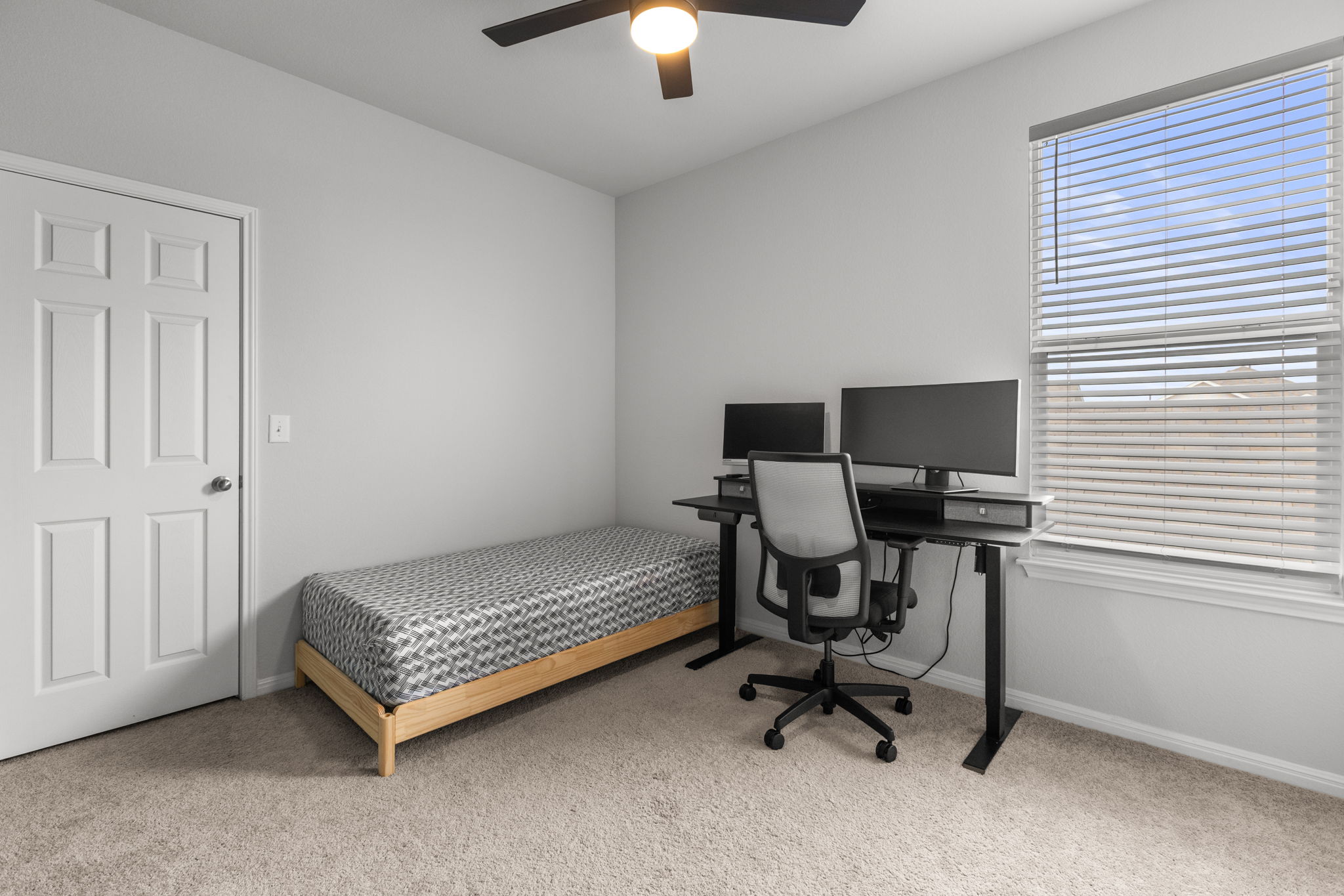 6402 Rafferty Lane Austin, TX 78747 - Photo 25 of 32 a view of a workspace with furniture and a window