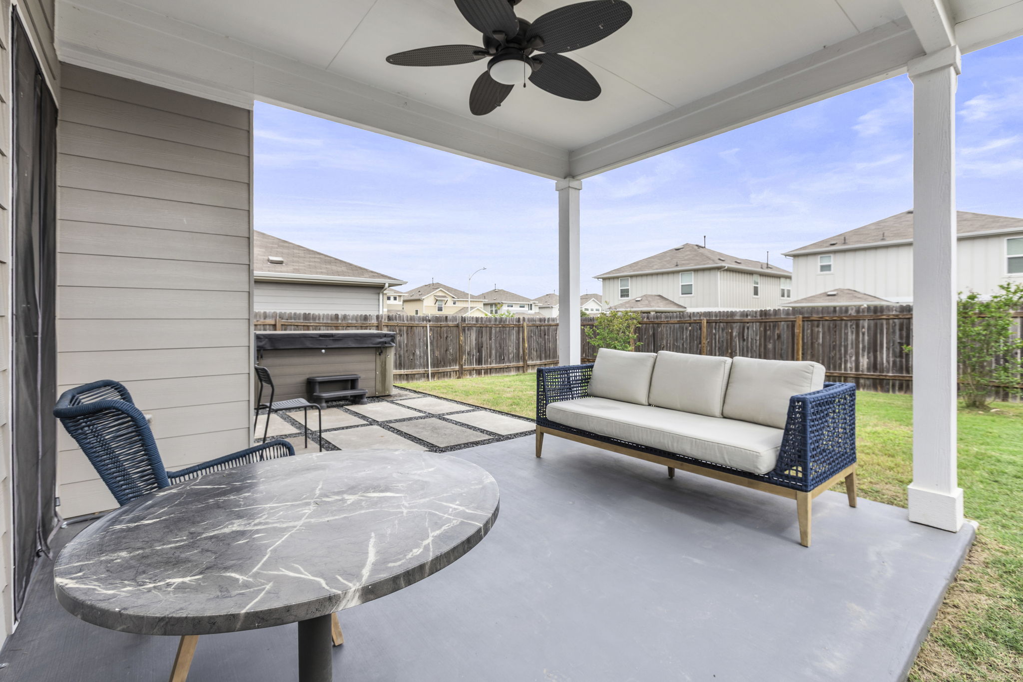 6402 Rafferty Lane Austin, TX 78747 - Photo 28 of 32 a living room with furniture and a large window