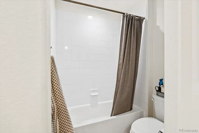 a bedroom with bed and window