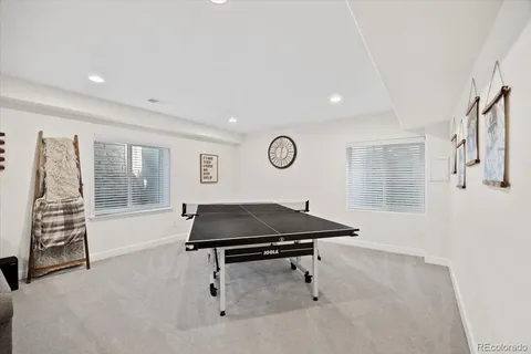 a bedroom with a bed a desk and chair