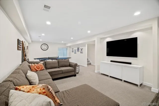 a bedroom with a bed a desk and chair