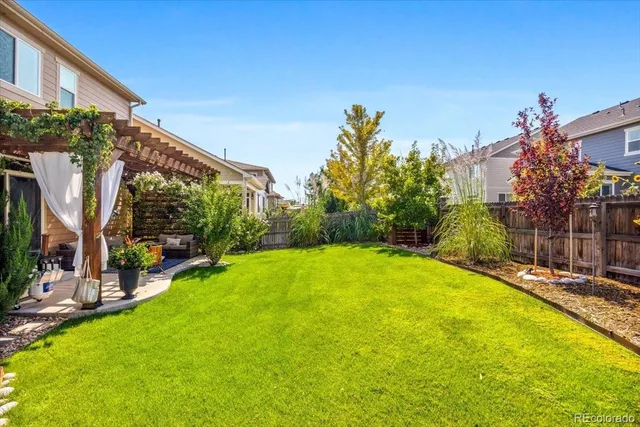a front view of a house with a yard and porch