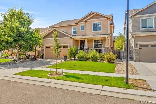 an aerial view of residential building and lake