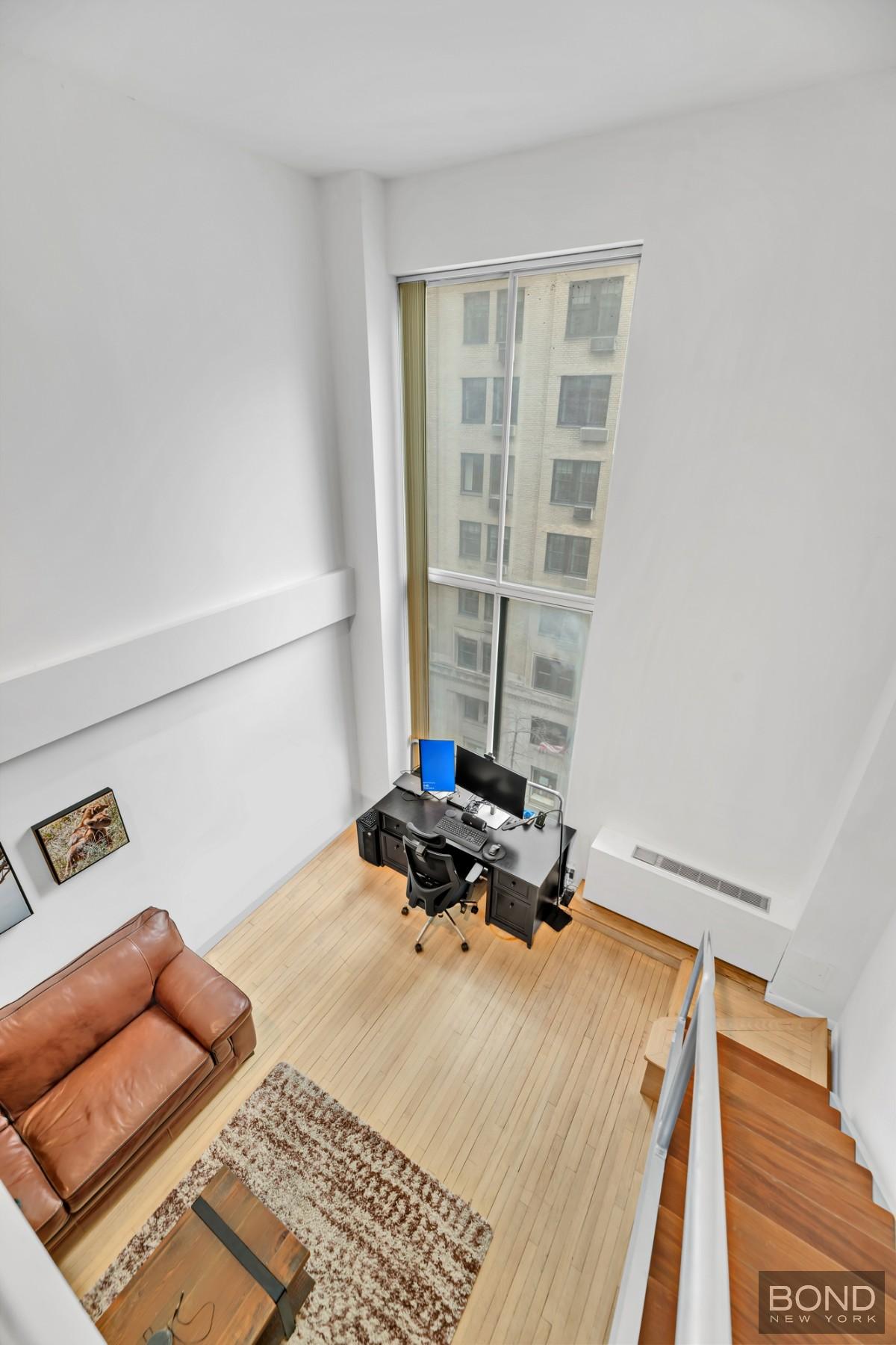 32 East 76th Street, Unit 502602 Manhattan, NY 10021 - Photo 4 of 8 a bedroom with furniture and a window