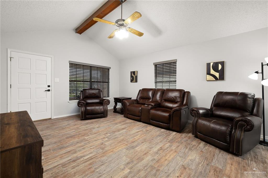 1815 Wilson Street Mission, TX 78572 - Photo 3 of 16 a living room with furniture and a flat screen tv