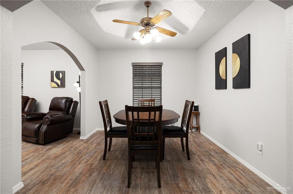 1815 Wilson Street Mission, TX 78572 - Photo 6 of 16 a view of a dining room with furniture and wooden floor