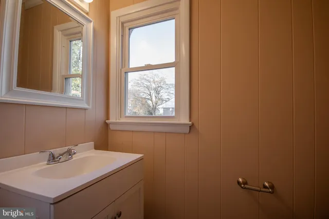 a bathroom with a sink and vanity