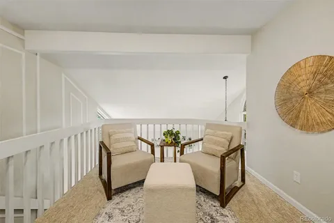 a spacious bedroom with a bed and a cabinets