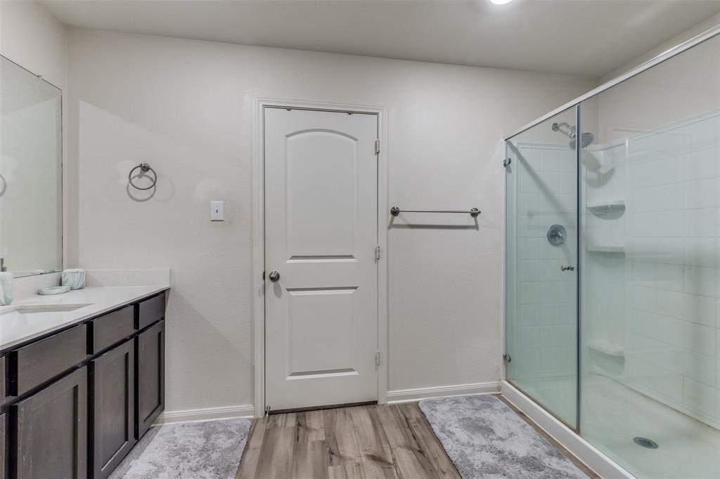 201 Cattlemans Crk Road Newark, TX 76071 - Photo 15 of 25 a bathroom with a sink and shower