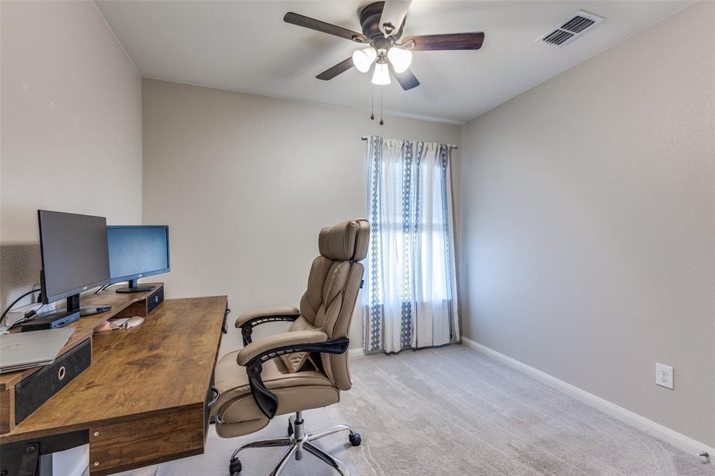 201 Cattlemans Crk Road Newark, TX 76071 - Photo 21 of 25 a view of a workspace with furniture and a window