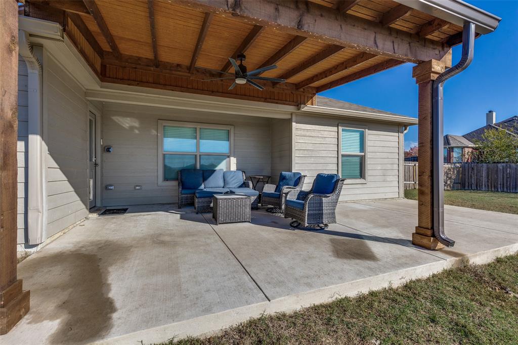 201 Cattlemans Crk Road Newark, TX 76071 - Photo 23 of 25 a view of a livingroom with chairs and tables in patio