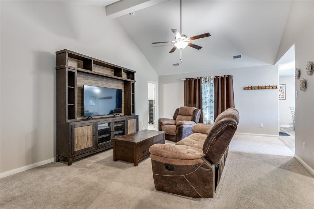 201 Cattlemans Crk Road Newark, TX 76071 - Photo 6 of 25 a living room with furniture and a flat screen tv