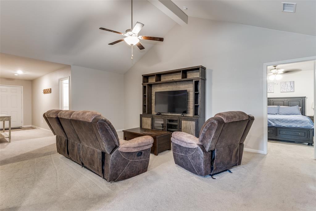 201 Cattlemans Crk Road Newark, TX 76071 - Photo 7 of 25 a living room with furniture and a flat screen tv