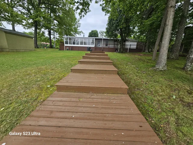 a view of park with large trees
