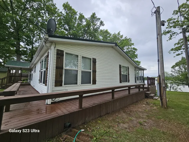 a view of house with yard