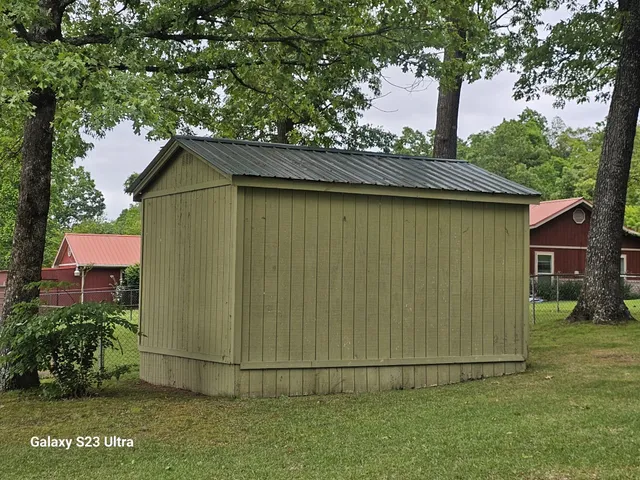 a backyard of a house with lots of green space