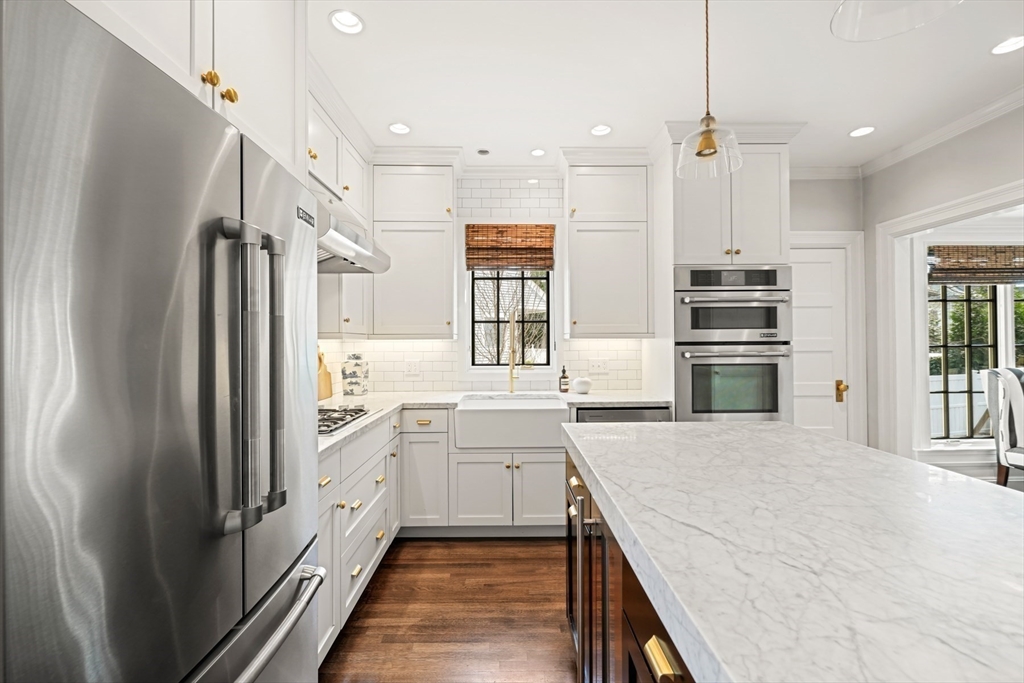 254 Commonwealth Avenue Newton, MA 02467 - Photo 11 of 37 a kitchen with a refrigerator sink and stove
