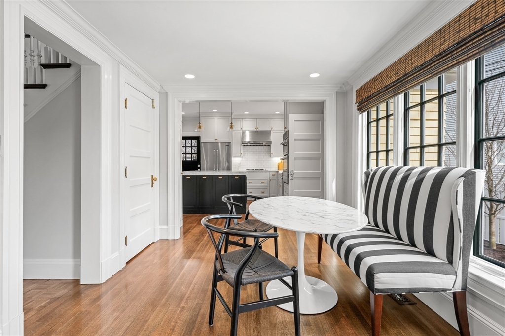 254 Commonwealth Avenue Newton, MA 02467 - Photo 14 of 37 a view of a dining room with furniture window and wooden floor