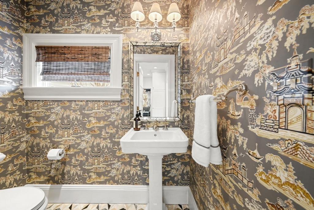 254 Commonwealth Avenue Newton, MA 02467 - Photo 15 of 37 a bathroom with a sink toilet and mirror