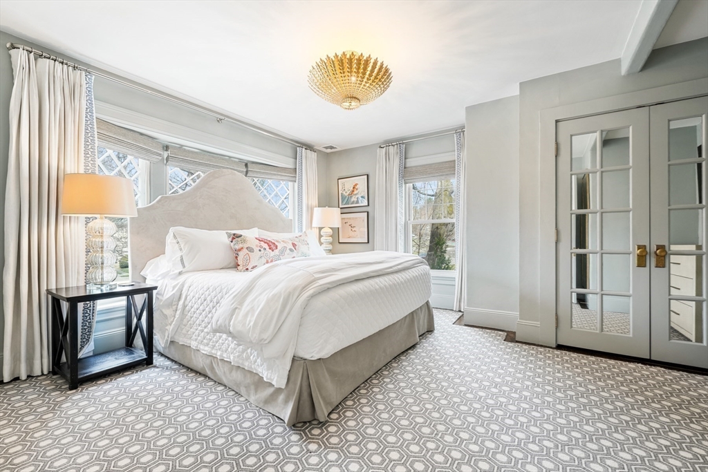 254 Commonwealth Avenue Newton, MA 02467 - Photo 17 of 37 a bedroom with a bed and a painting on the wall