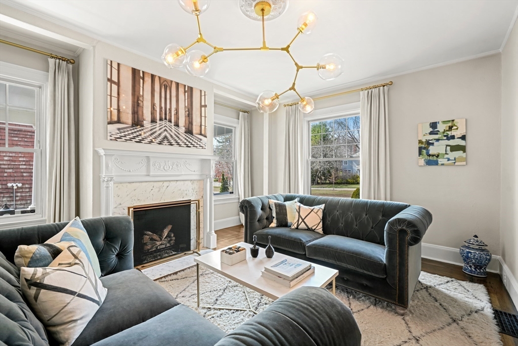 254 Commonwealth Avenue Newton, MA 02467 - Photo 2 of 37 a living room with furniture and a fireplace