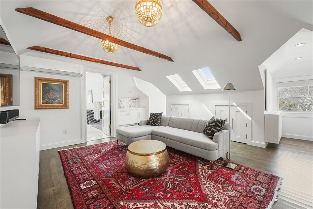 254 Commonwealth Avenue Newton, MA 02467 - Photo 25 of 37 a living room with furniture and a rug