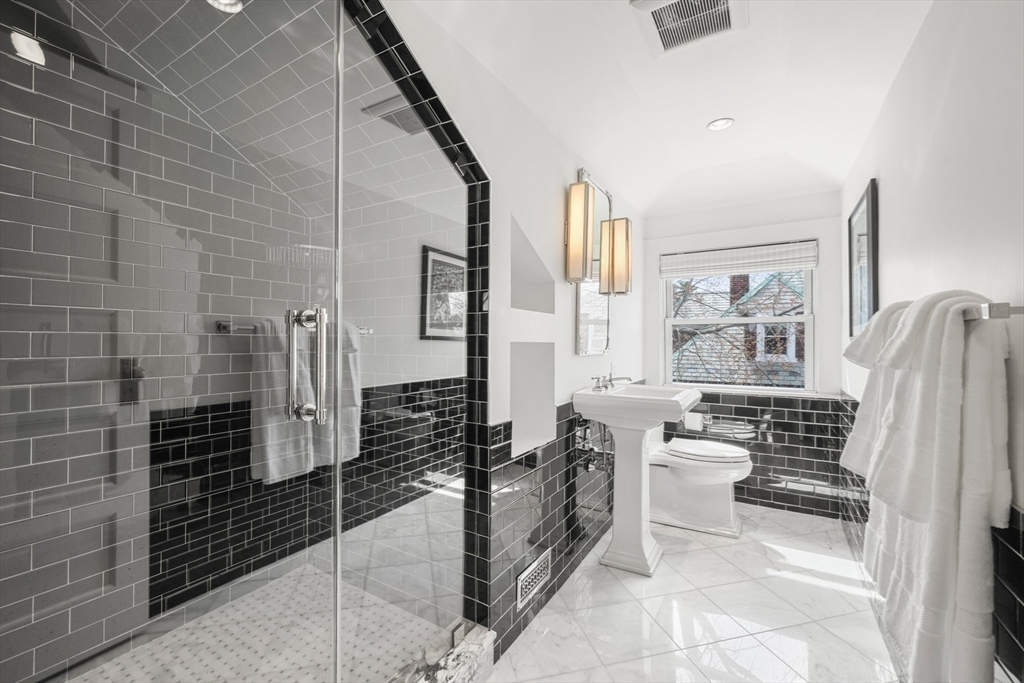 254 Commonwealth Avenue Newton, MA 02467 - Photo 28 of 37 a bathroom with a toilet sink and shower